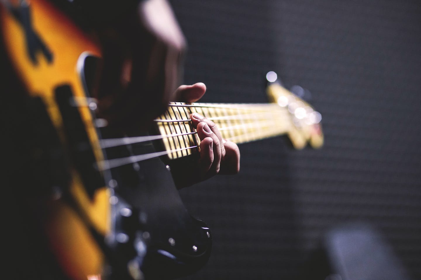 Musician playing guitar and promoting music online